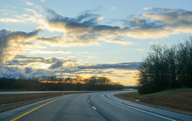 Naklejka premium road in the sunset
