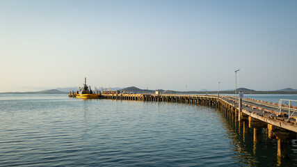 The long historical jetty, now mostly unused, in the town of Bowen in the Whitsunday region of...