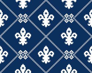 Fleur de lis seamless pattern.Classic royal embroidery vintage style.Traditional and little more modern. Flower with French origins.Vector illustration blue and white background design for decor. © Cozy Wind Design