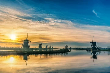 Fotobehang Rotterdam Netherlands, sunrise nature landscape of Dutch Windmill at Kinderdijk Village © Noppasinw