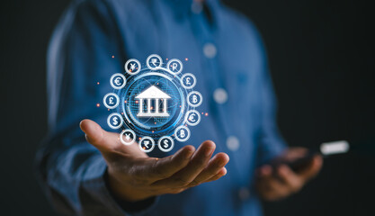 Businessman using smartphone with central banking and international currency include dollar Yuan Yen Pound sterling and Euro for forex and currency exchange money transfer concept. Business, finance