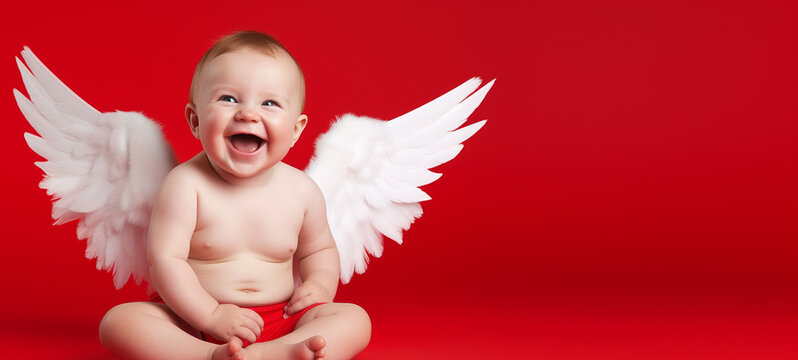 Cheerful baby angel cupid with white wings on vibrant red background