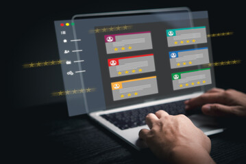 Businessman using laptop digital interface feedback review stars rating online internet survey assessment quality consumer or e-commerce service evaluation satisfaction