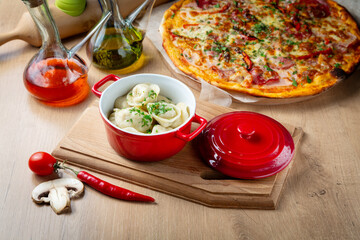 Homemade dumplings with meat, pizza and butter on the table, cafe, lunch