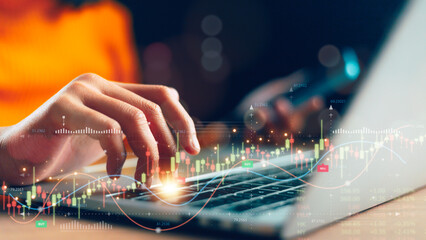 Businesswoman analyzing stock market graph data with financial graph, business growth with the...