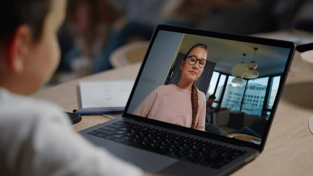 Happy children talk web cam at home closeup. Joyful teen girl waving in screen