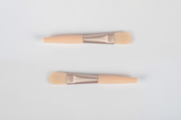 Cosmetic brushes on white background. Set of makeup brushes