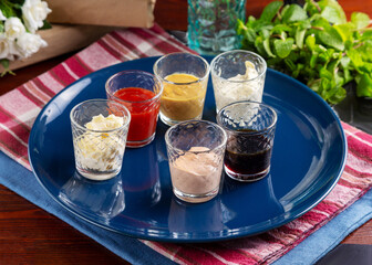 Assorted sauces on a plate on the table