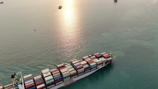 top view Cargo Container ship at sunset ship. container and running for import export concept technology freight shipping by ship