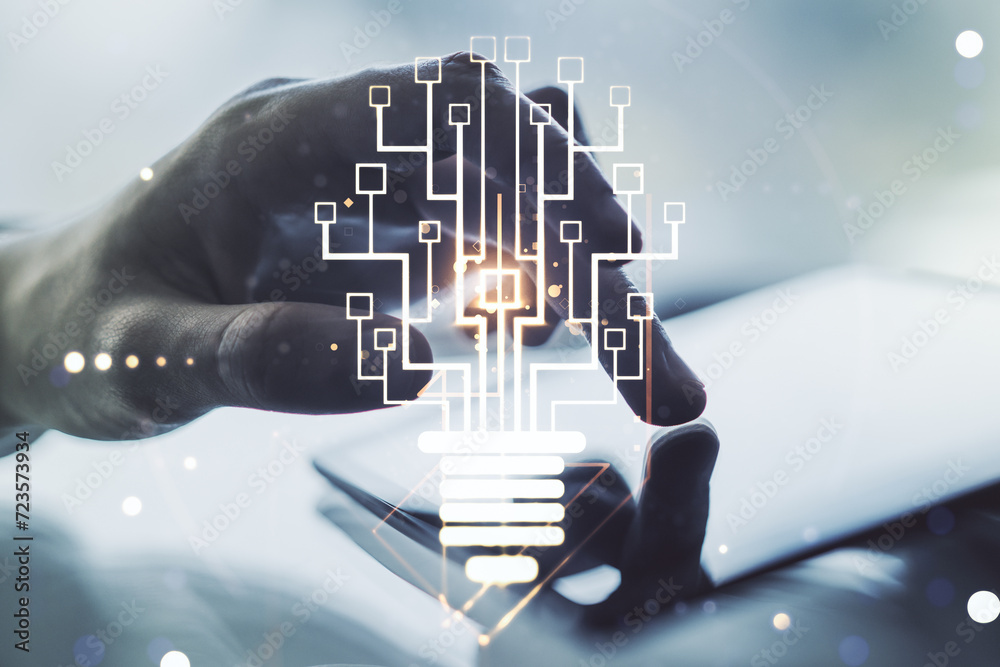 Leinwandbilder creative light bulb with chip hologram and hand working with a digital tablet on background, artific