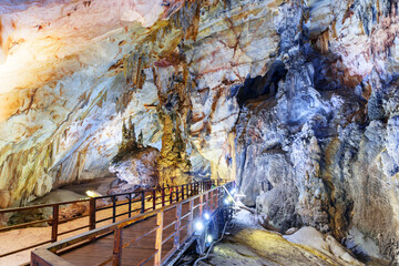 Wooden walkway through beautiful natural corridor, Paradise Cave