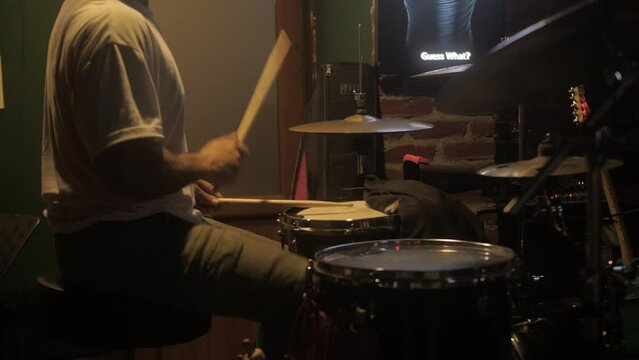 man playing percussion musical instrument