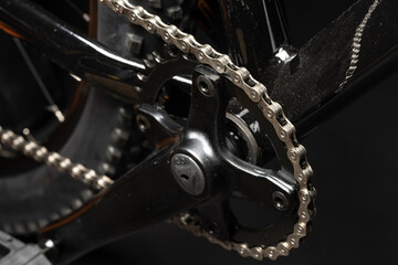 New bicycle chain part close up on black background