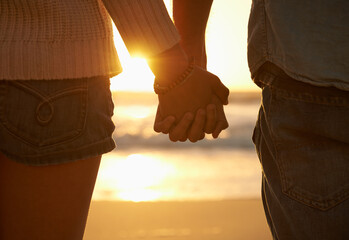 Couple, holding hands and beach or sunset love at waves for vacation journey, peace or support....