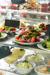 Showcase with salads in the dining room or cafeteria