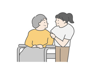 女性介護士と車椅子に乗った高齢女性