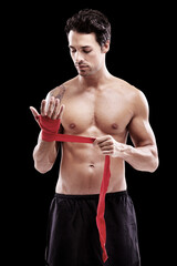 Man, hand wrap and fitness with boxer in a studio ready for boxing training and workout. Body, athlete and male fighter from Brazil with exercise, sport and wellness for battle with black background
