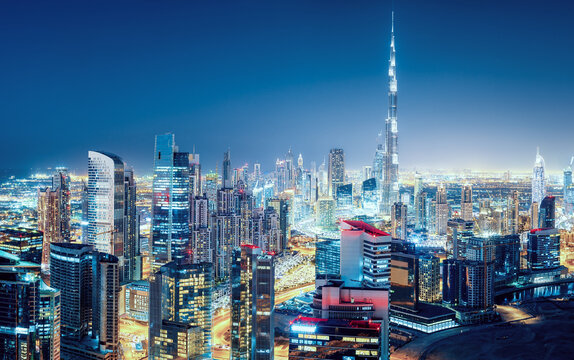 Fantastic nightime skyline of a big modern city. Downtown Dubai, United Arab Emirates. Colourful cityscape with skyscrapers. © Funny Studio