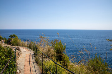 Portofino pedestrian pathway for hiking Mediterranean sea coast with  protective barrier