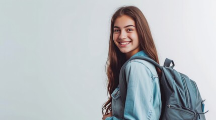 Young happy student with backpack on white - obrazy, fototapety, plakaty