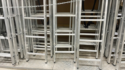 Aluminum stairs in the store, Stairs of ladder for construction in shop, New aluminum stepladders...