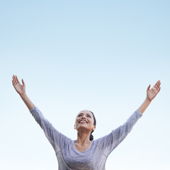 Woman, arms up and blue sky with freedom and happiness outdoor, health and wellness, stress relief...
