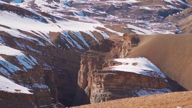 Landscape shot of a canyon between the two mountains as seen on the way to Hikkim village in Spiti Valley, Himachal Pradesh, India. View of canyon in between the Himalayan mountains in Spiti Valley.