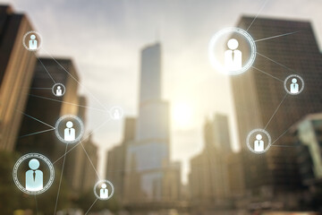 Fototapeta premium Double exposure of abstract virtual social network icons on modern skyscrapers background. Marketing and promotion concept