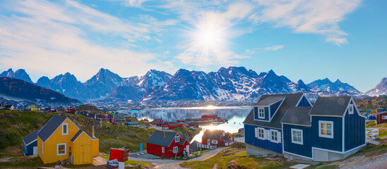 Picturesque village on coast of Greenland - Colorful houses in Tasiilaq, East Greenland - obrazy, fototapety, plakaty