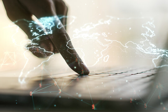 Abstract creative digital world map and hands typing on laptop on background, globalization concept. Multiexposure - Powered by Adobe