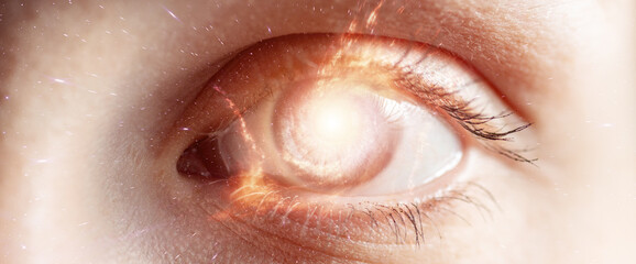 Small galaxy in human eye. Concept image.