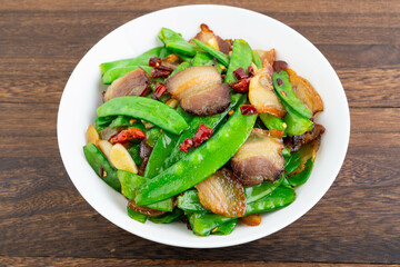 A plate of fried peas and bacon