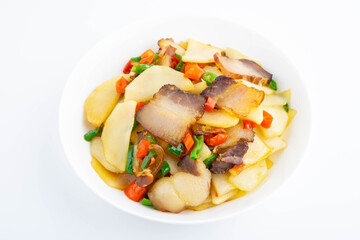 A dish of stir-fried bacon with mustard greens