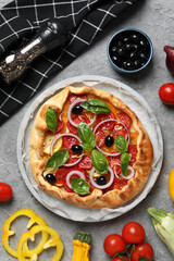 Freshly baked vegetable galette with fresh vegetables