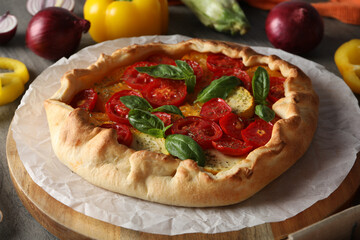 Freshly baked vegetable galette with fresh vegetables