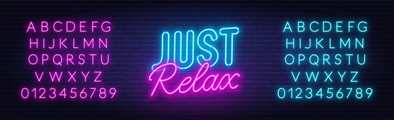 Just Relax neon lettering on brick wall background