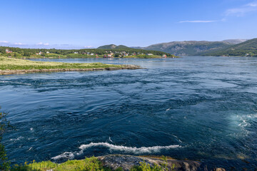 Fototapeta na wymiar The Saltstraumen current is a symphony of color and motion, its vibrant blues and whites creating a stunning natural mosaic. Bodo, Norway