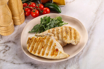 Grilled chicken breast served arugula