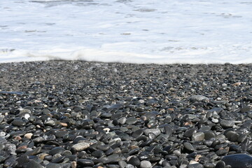 Wet stones on the beach 