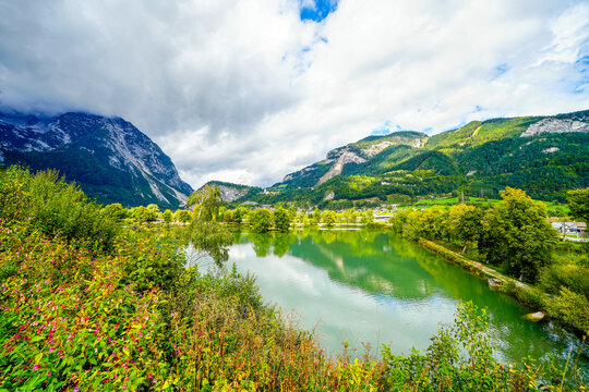 Pond with the surrounding nature and mountains near Trautenfels Castle near Liezen in Styria. Landscape in Austria in the Salzkammergut.
