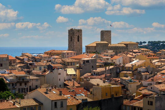 Red roofs, old houses and medieval towers in Antibes, France.