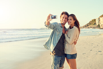 Couple, selfie and smile for hug by sea for memory on vacation with care, love and tropical beach....