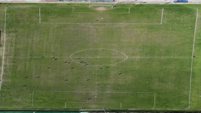 Aerial drone over a football soccer green field