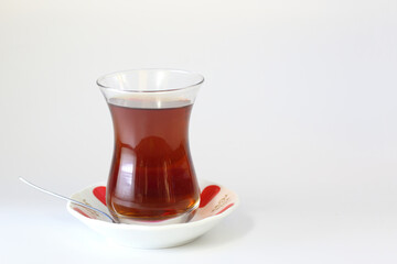 glass of turkish black tea on white background