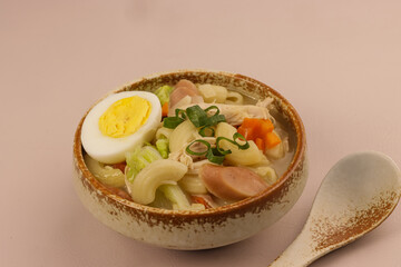 Chicken Sopas is Filipino Style Chicken Macaroni Soup with Flaked Chicken, Vegetables and Sausages.