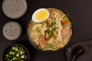 Chicken Sopas is Filipino Style Chicken Macaroni Soup with Flaked Chicken, Vegetables and Sausages.