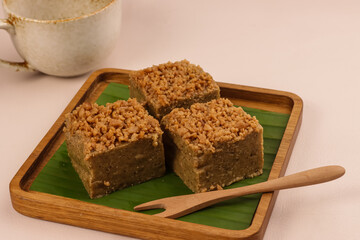 Kuih Koleh Kacang is a Malaysian Traditional Dessert Made From Mung Bean Flour and Coconut Milk, Topping with Tahi Minyak. 