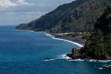 views of the beach and mountain cliffs