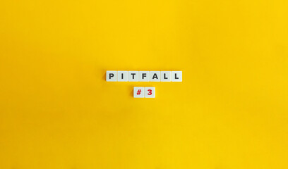 Pitfall Word and Banner. Block Letter Tiles on Yellow  Orange Background. Minimalist Aesthetics.