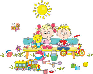 Little boy and girl sitting on a colorful bench among their funny toys and reading an interesting children’s book with pictures in a park on a sunny summer day, vector cartoon illustration on white